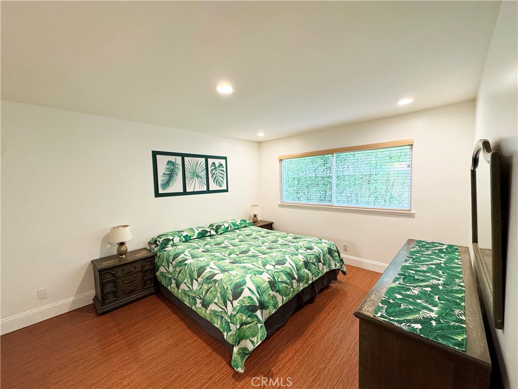 11596 Lakia Drive Cypress, CA 90630 - Photo 29 of 46 a bedroom with bed and a window