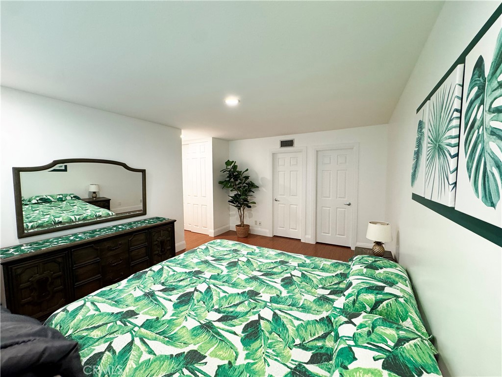 11596 Lakia Drive Cypress, CA 90630 - Photo 31 of 46 a bedroom with a bed and a dresser