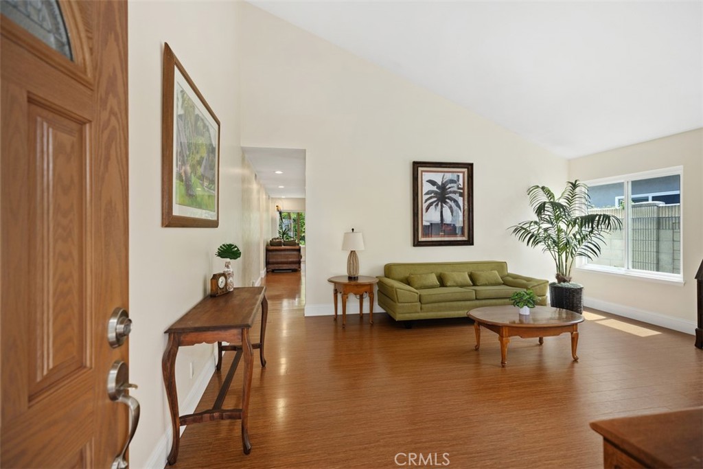 11596 Lakia Drive Cypress, CA 90630 - Photo 7 of 46 a living room with furniture and a wooden floor