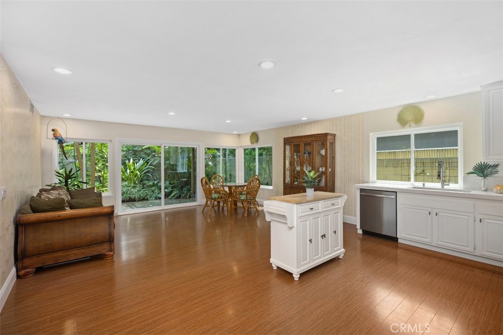11596 Lakia Drive Cypress, CA 90630 - Photo 10 of 46 a living room with furniture and large windows