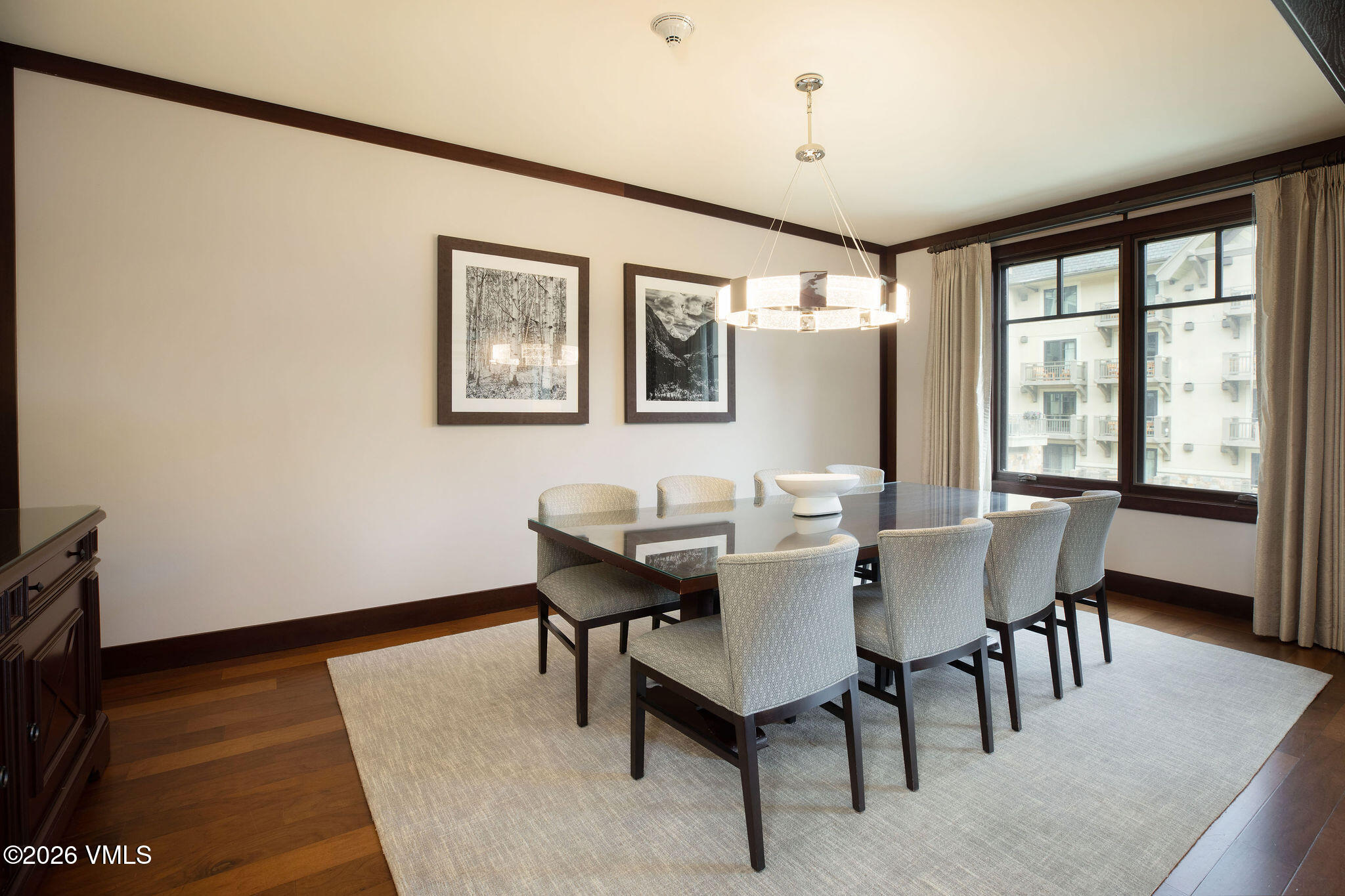 1 Vail Road, Unit 5102J Vail, CO 81657 - Photo 6 of 26 a view of a dining room with furniture and wooden floor