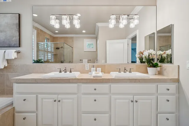 a bathroom with a sink double vanity and a mirror