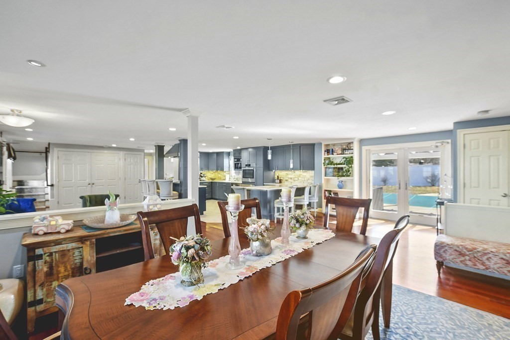 61 Court Road Braintree, MA 02184 - Photo 12 of 42 a dining room with stainless steel appliances kitchen island granite countertop a dining table chairs and view living room