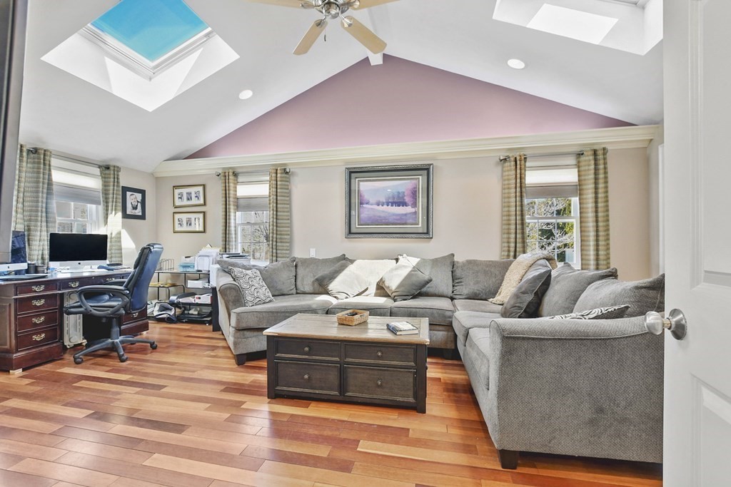 61 Court Road Braintree, MA 02184 - Photo 13 of 42 a living room with furniture flat screen tv and a large window