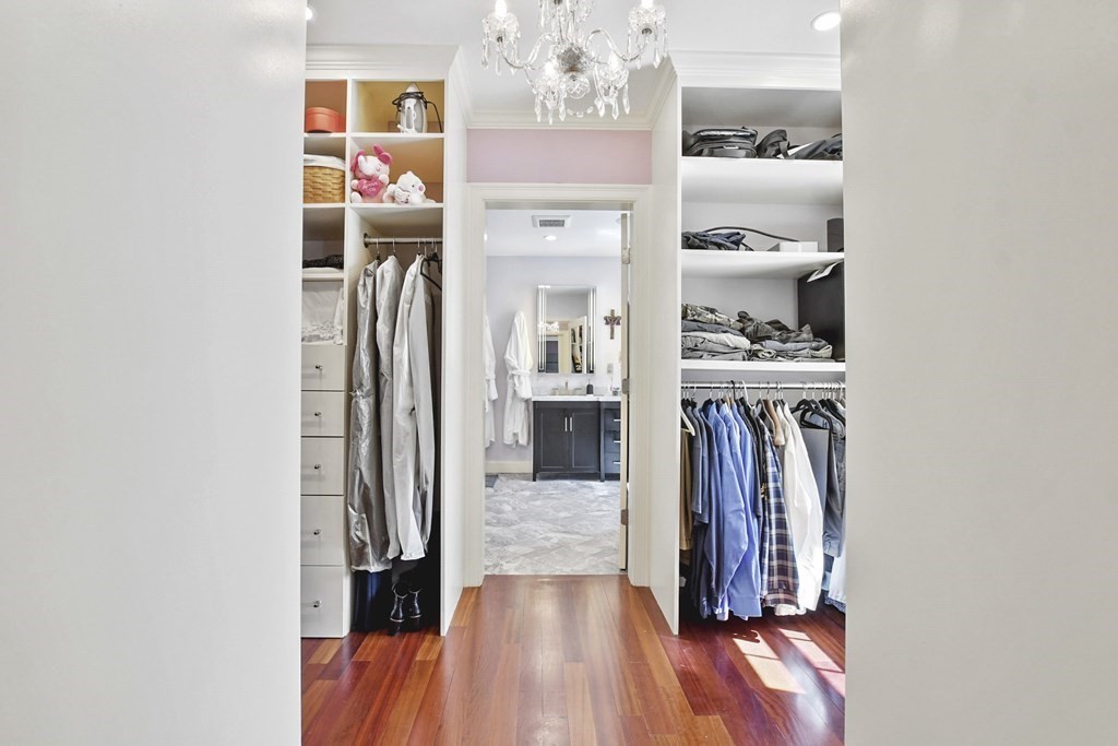 61 Court Road Braintree, MA 02184 - Photo 18 of 42 a view of a hallway with wooden floor and a kitchen