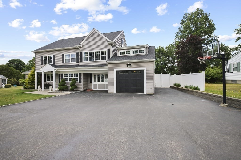 61 Court Road Braintree, MA 02184 - Photo 2 of 42 a view of an house with backyard and parking