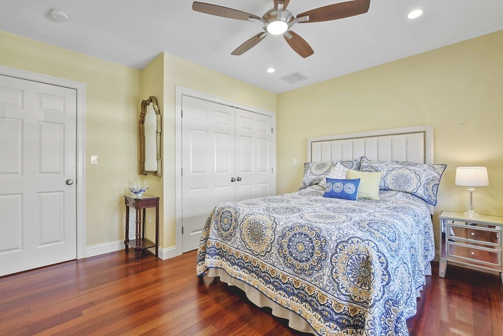 61 Court Road Braintree, MA 02184 - Photo 21 of 42 a bedroom with a bed and wooden floor