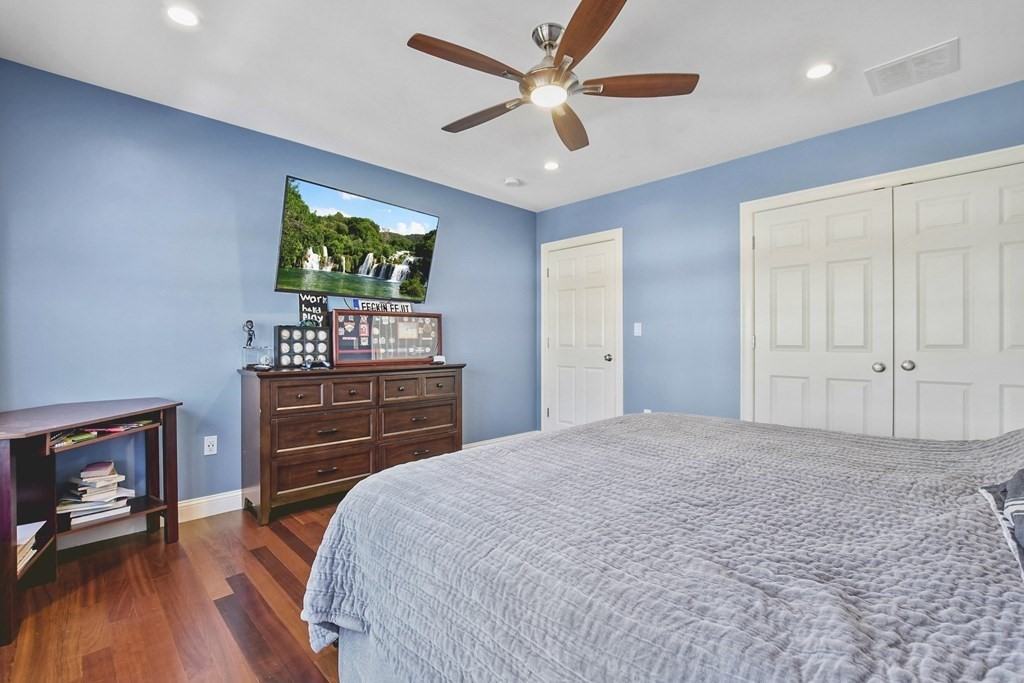 61 Court Road Braintree, MA 02184 - Photo 22 of 42 a bedroom with a bed and a flat screen tv