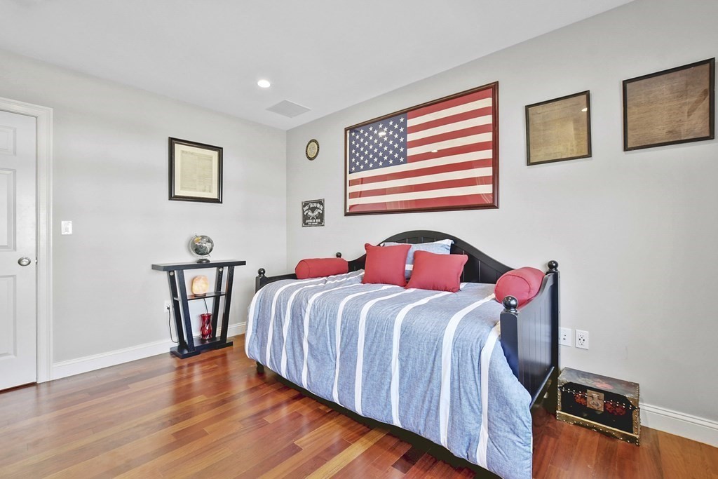 61 Court Road Braintree, MA 02184 - Photo 23 of 42 a bedroom with a bed and wooden floor