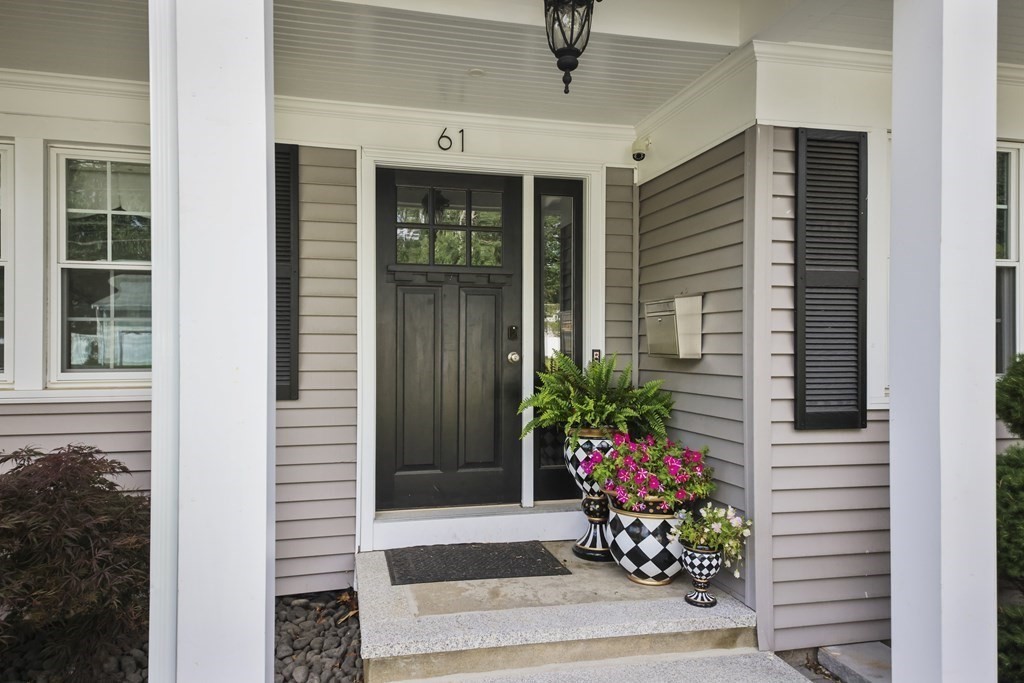 61 Court Road Braintree, MA 02184 - Photo 3 of 42 a potted plant sitting in front of a house