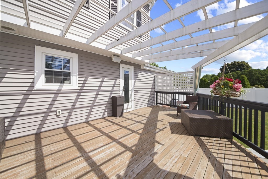 61 Court Road Braintree, MA 02184 - Photo 34 of 42 a view of a patio with a table and chairs and wooden floor