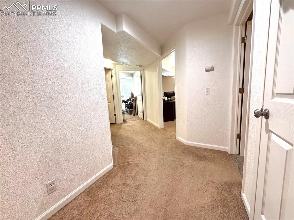 9362 St.George Road Peyton, CO 80831 - Photo 27 of 35 Basement Hallway