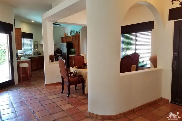 a kitchen with stainless steel appliances granite countertop a sink dishwasher stove top oven and refrigerator