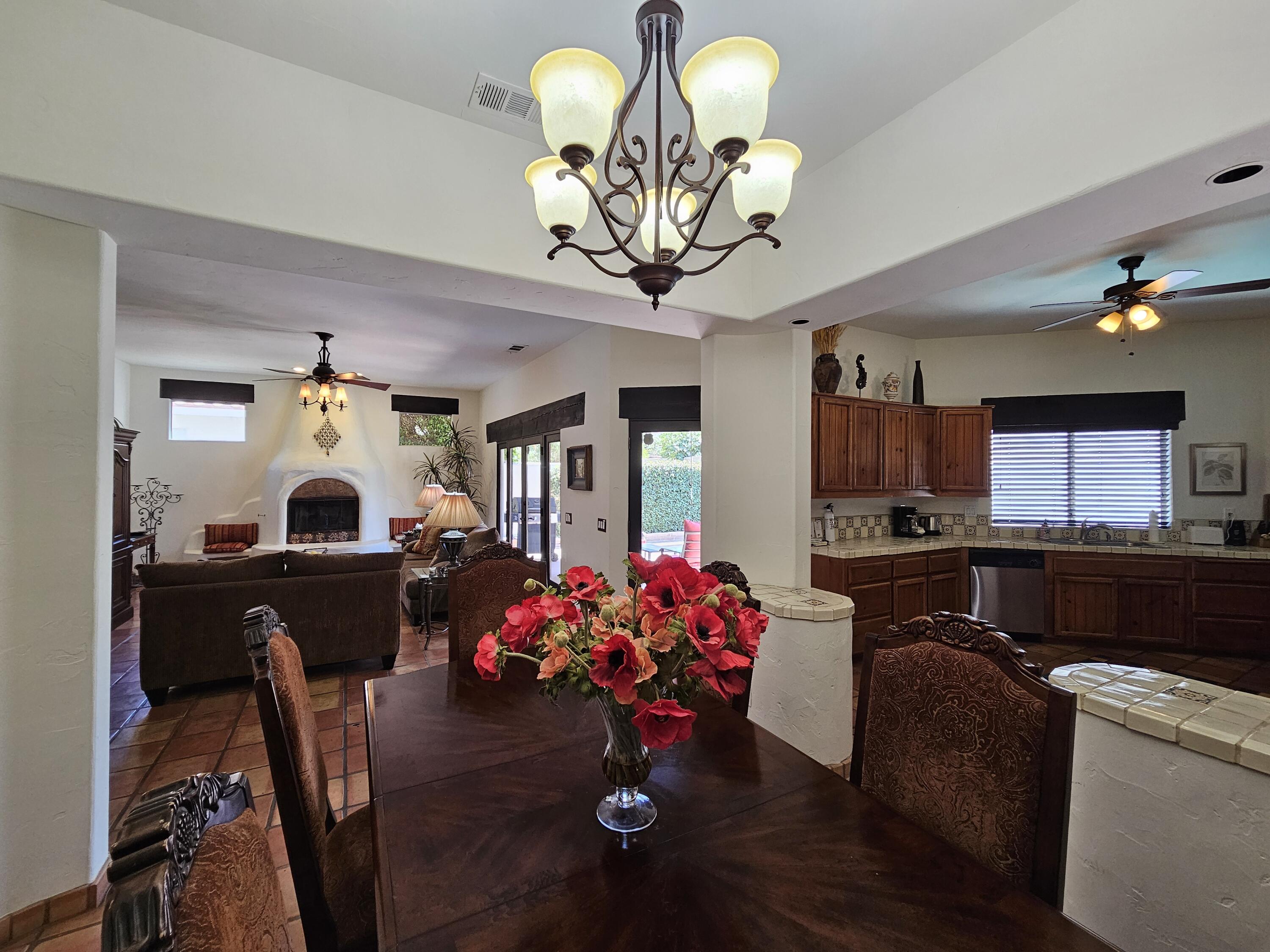 52225 Avenida Obregon La Quinta, CA 92253 - Photo 15 of 39 a view of a dining room with furniture and a chandelier