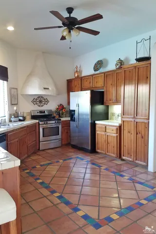 a kitchen with a stove and cabinets
