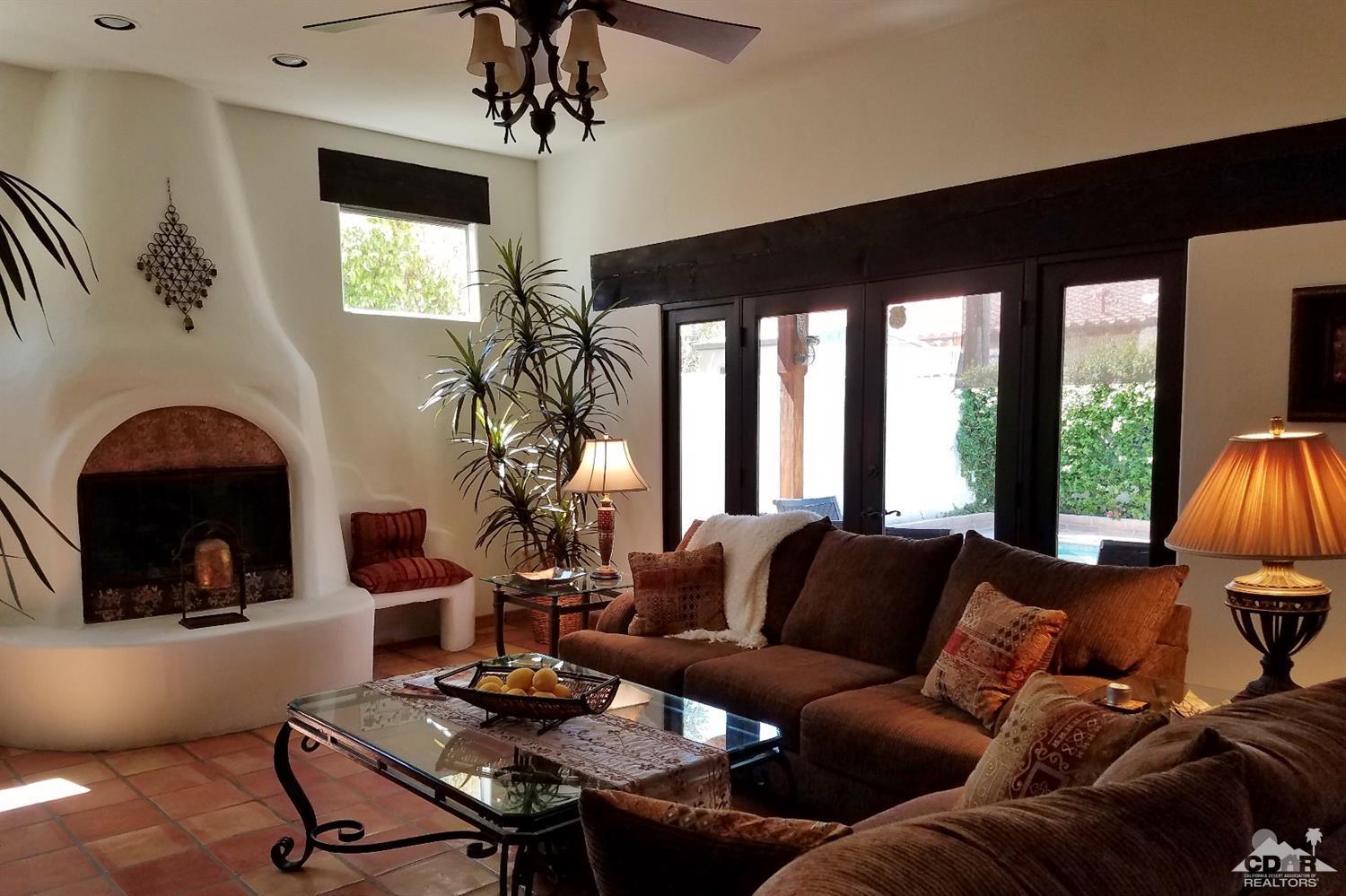 52225 Avenida Obregon La Quinta, CA 92253 - Photo 30 of 34 a living room with furniture and a large window