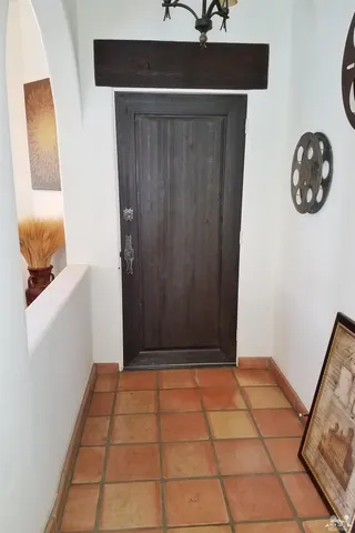 a room with furniture and gym equipment