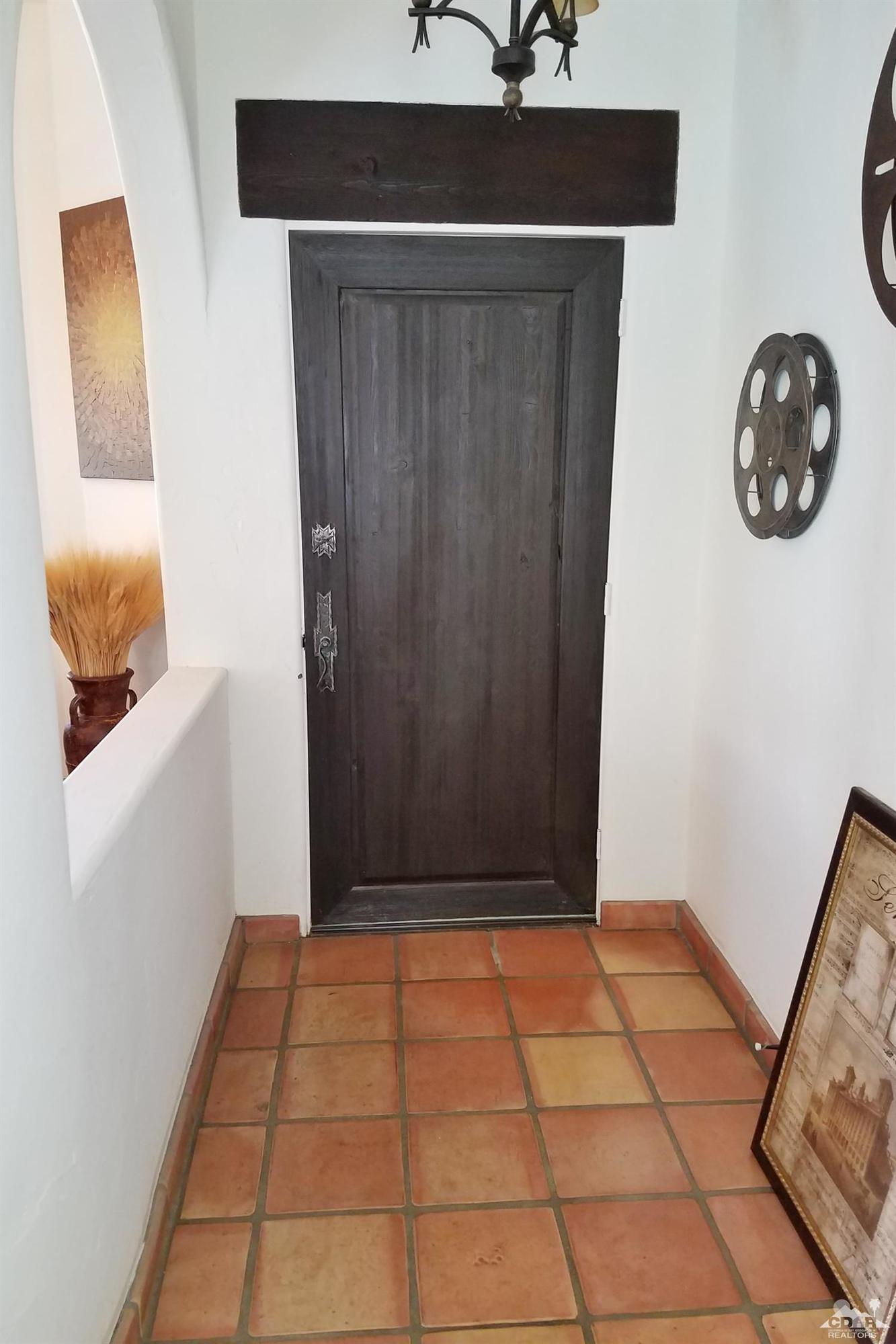 52225 Avenida Obregon La Quinta, CA 92253 - Photo 10 of 34 a view of a hallway with washer and dryer