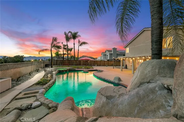 a view of a swimming pool with a patio