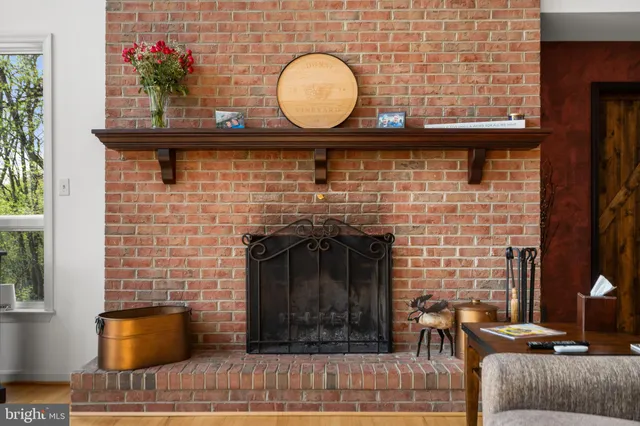 a view of staircase with a floor to ceiling window and wooden floor