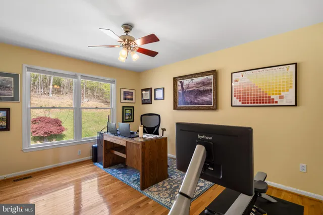 a view of a building with sitting area and porch