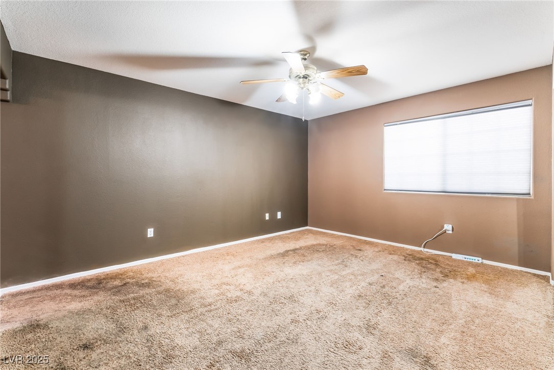 1851 Hillpointe Road, Unit 2912 Henderson, NV 89074 - Photo 14 of 28 Carpeted spare room with ceiling fan and baseboards