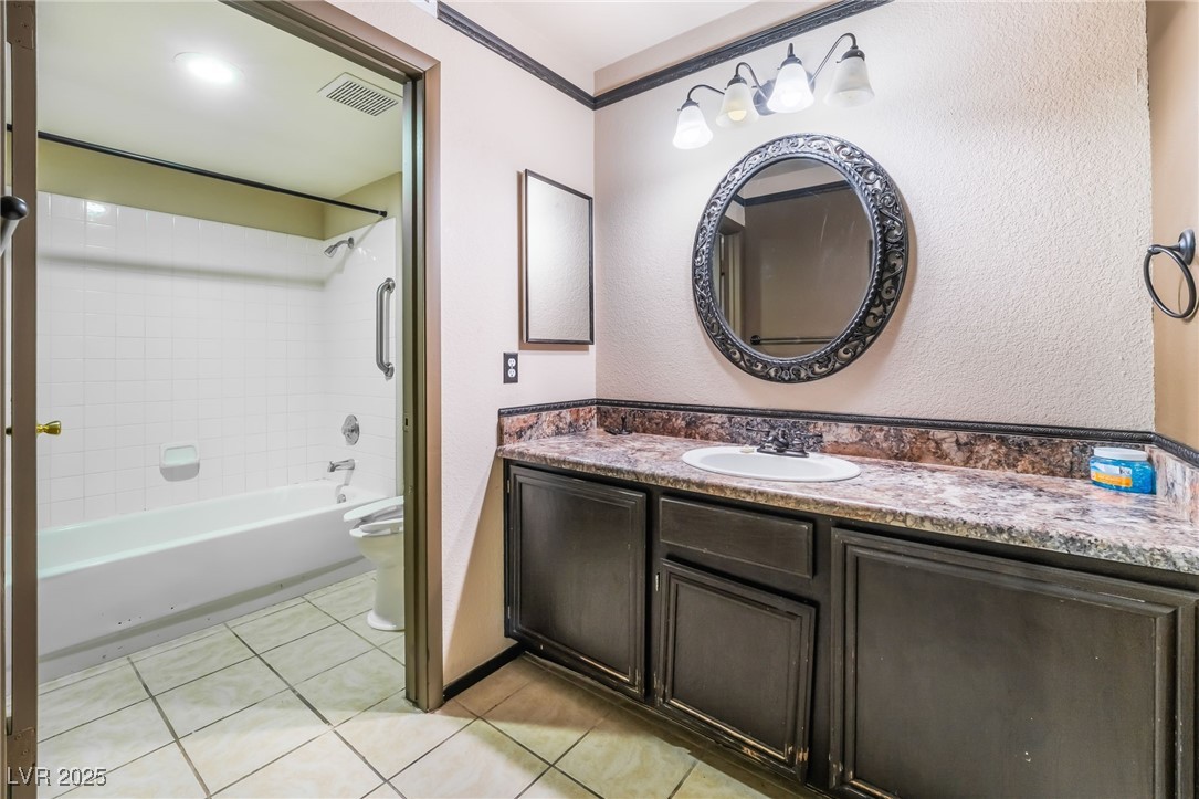 1851 Hillpointe Road, Unit 2912 Henderson, NV 89074 - Photo 16 of 28 Full bath featuring bathtub / shower combination, visible vents, toilet, vanity, and tile patterned flooring