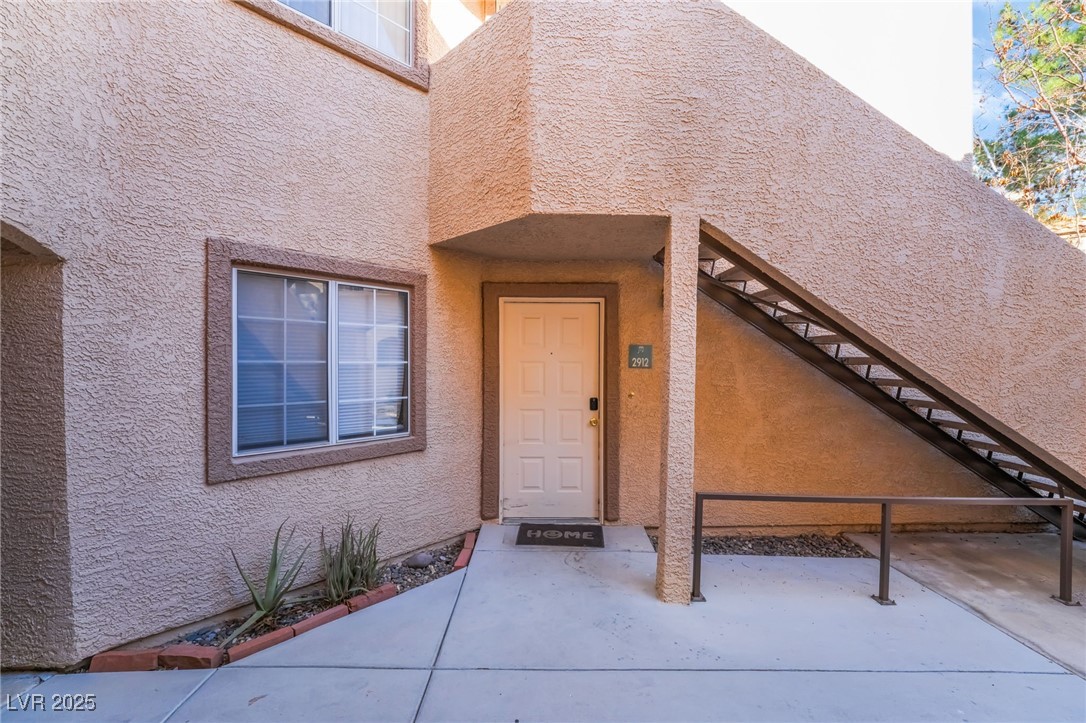 1851 Hillpointe Road, Unit 2912 Henderson, NV 89074 - Photo 3 of 28 View of exterior entry with stucco siding