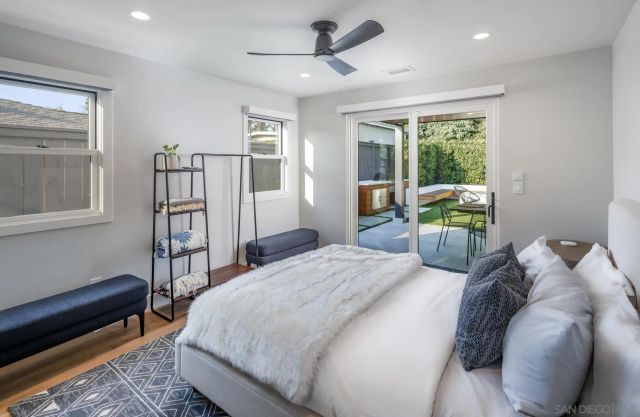 a bed room with a bed and a chair