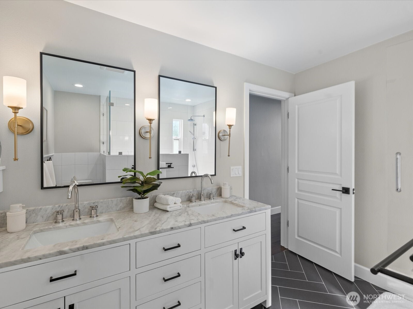 17412 Northeast 40th Place, Unit A6 Redmond, WA 98052 - Photo 23 of 40 a bathroom with double sink and a mirror