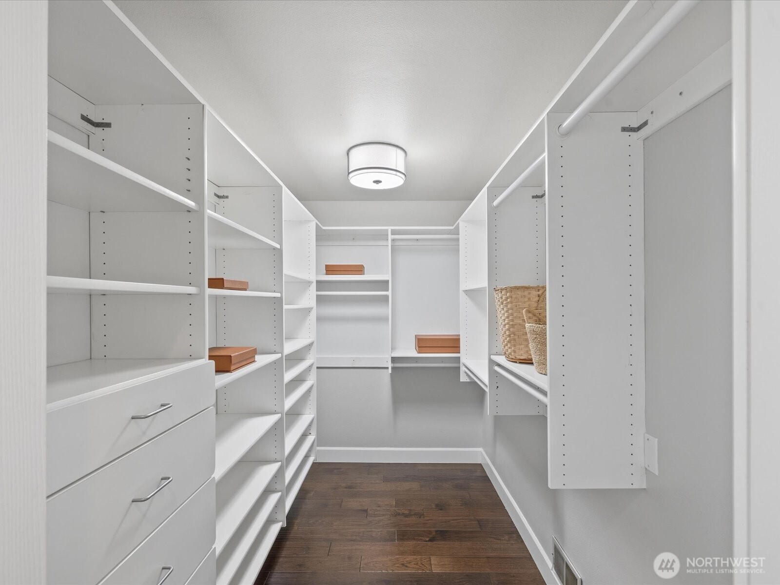 17412 Northeast 40th Place, Unit A6 Redmond, WA 98052 - Photo 25 of 40 a room with white cabinets and wooden floors