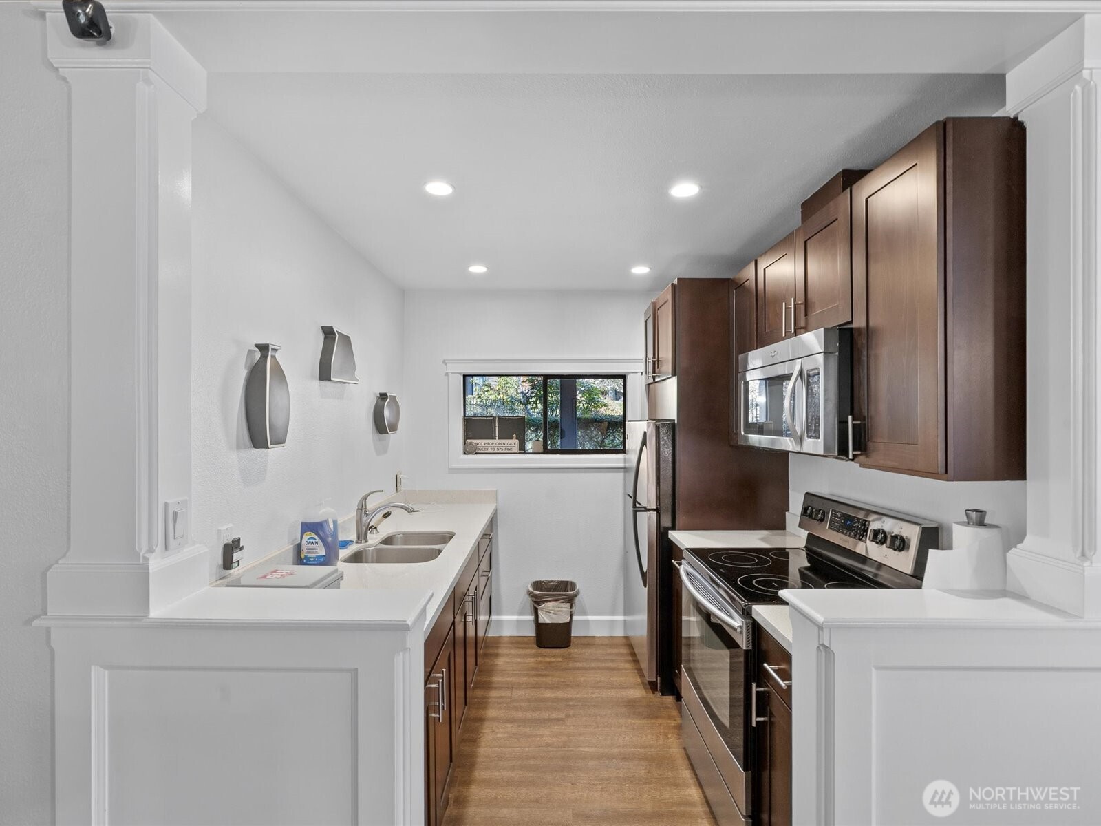 17412 Northeast 40th Place, Unit A6 Redmond, WA 98052 - Photo 36 of 40 a kitchen with a sink appliances and cabinets