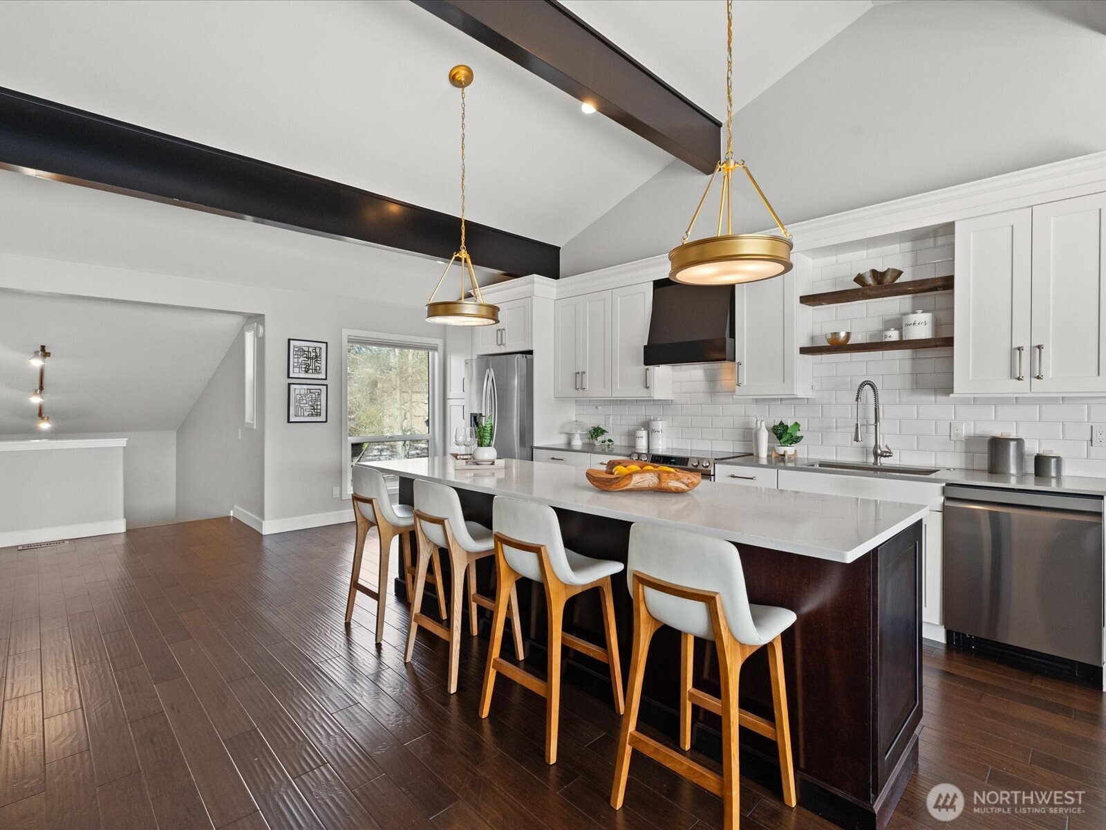 17412 Northeast 40th Place, Unit A6 Redmond, WA 98052 - Photo 7 of 40 a kitchen with a dining table chairs wooden floor and appliances