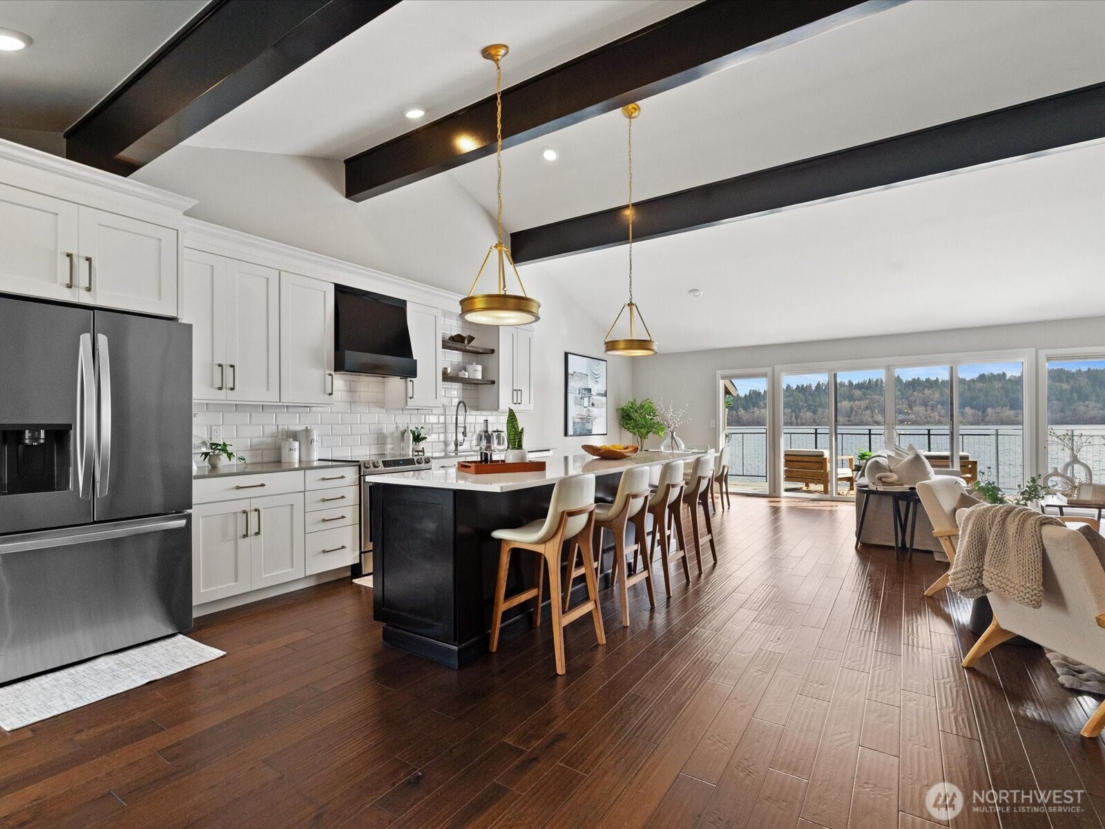 17412 Northeast 40th Place, Unit A6 Redmond, WA 98052 - Photo 9 of 40 a kitchen with a dining table wooden floor stainless steel appliances and cabinets