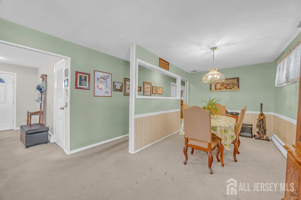 531 Chestnut Street Middlesex, NJ 08846 - Photo 12 of 42 a view of a dining room with furniture and a chandelier