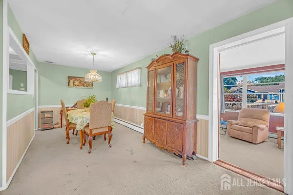 a view of livingroom with furniture window and front door