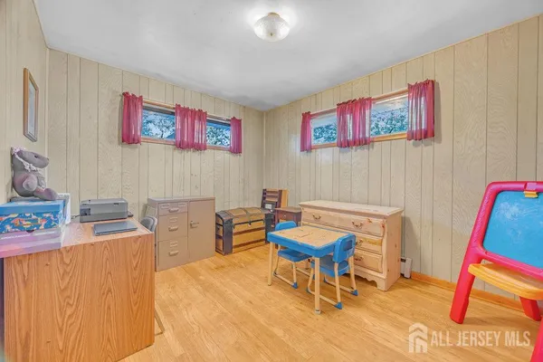 a room with furniture and a wooden floor