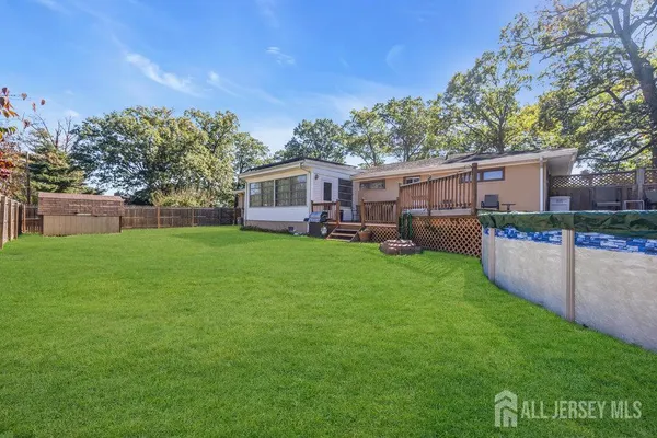 a view of a house with a backyard porch and sitting area