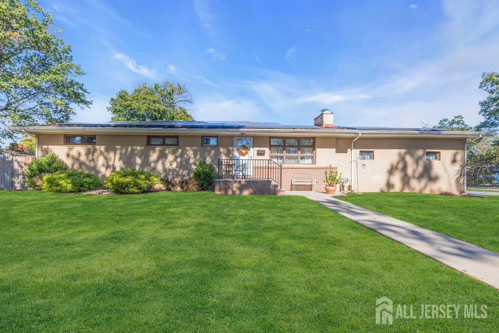 531 Chestnut Street Middlesex, NJ 08846 - Photo 3 of 42 a view of a pathway with a big yard and large trees