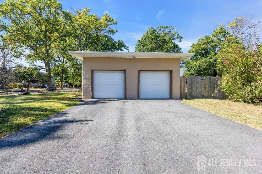 531 Chestnut Street Middlesex, NJ 08846 - Photo 35 of 42 a view of a house with a yard and garage