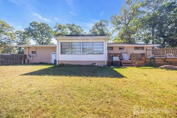 a view of swimming pool with outdoor seating and yard