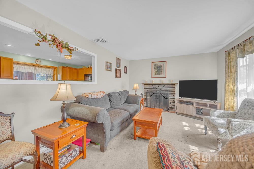 531 Chestnut Street Middlesex, NJ 08846 - Photo 42 of 42 a living room with furniture a flat screen tv and a window