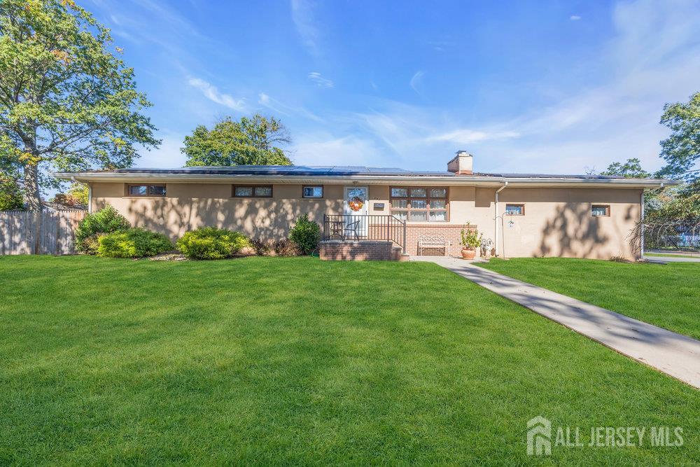 531 Chestnut Street Middlesex, NJ 08846 - Photo 6 of 42 a view of building with garden and bench in the background