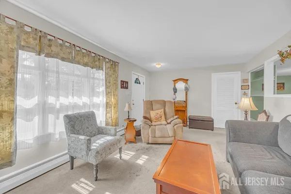 a living room with furniture and a table