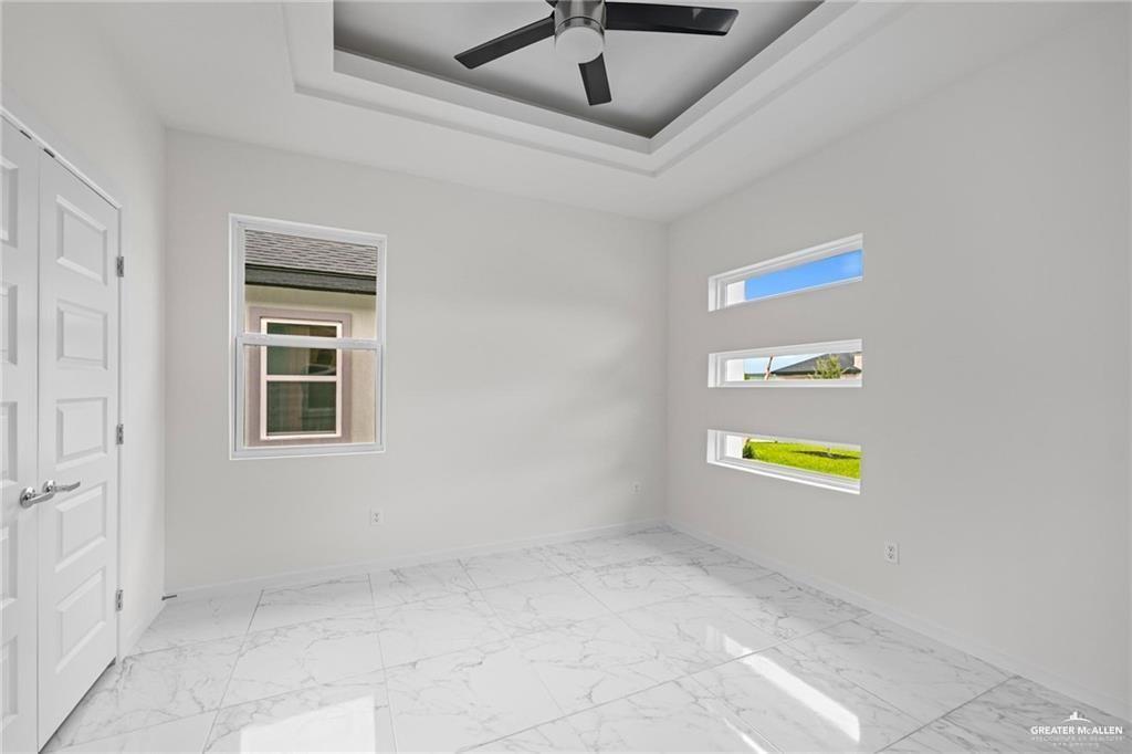 2737 East Conroe Road Edinburg, TX 78542 - Photo 6 of 14 a view of an empty room and a window
