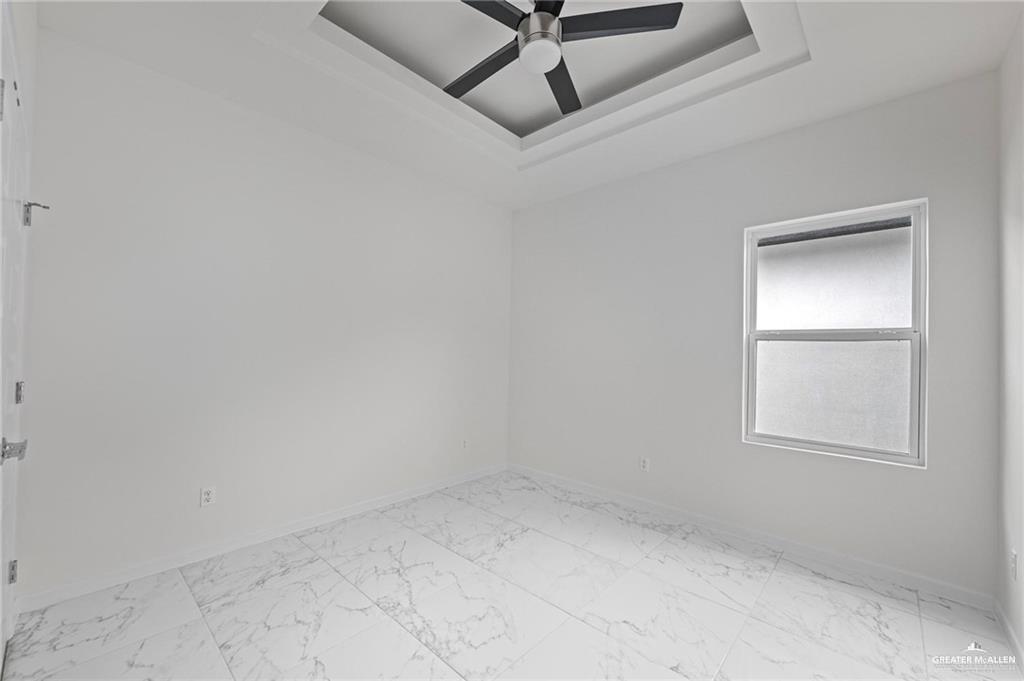 2737 East Conroe Road Edinburg, TX 78542 - Photo 8 of 14 an empty room with a window