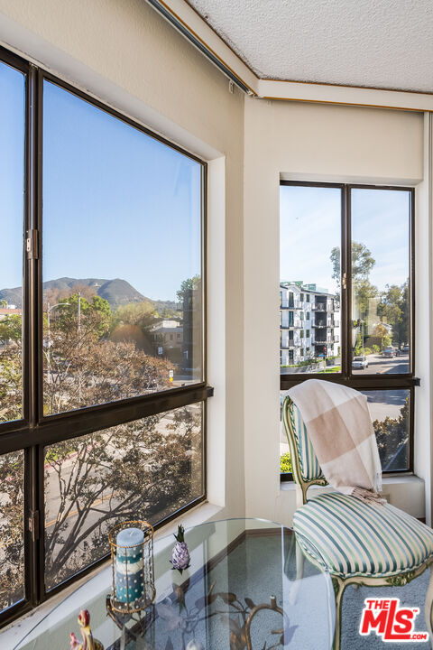 10409 Riverside Drive, Unit 203 Toluca Lake, CA 91602 - Photo 23 of 34 a living room with furniture and a large window