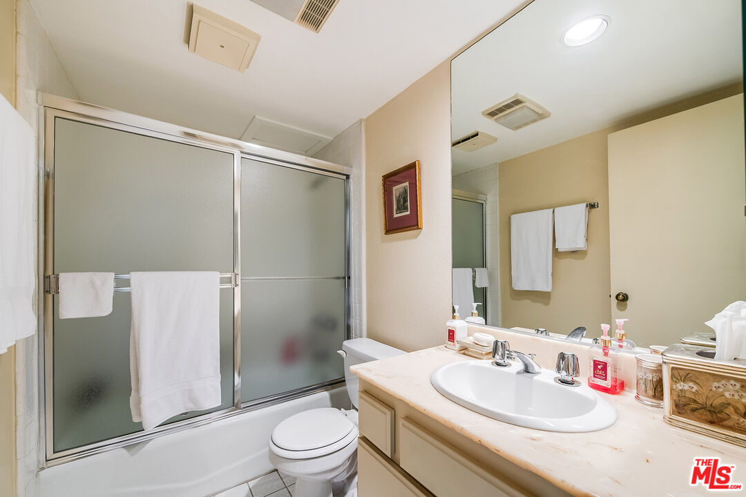 10409 Riverside Drive, Unit 203 Toluca Lake, CA 91602 - Photo 25 of 34 a bathroom with a sink toilet and shower