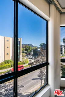 a room with a bed and a chandelier