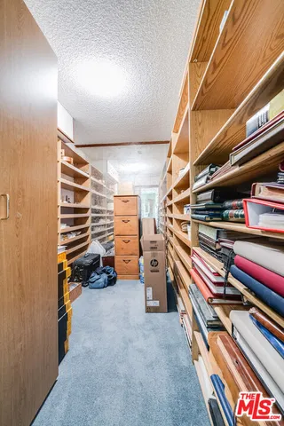 a utility room with cabinets dryer and washer